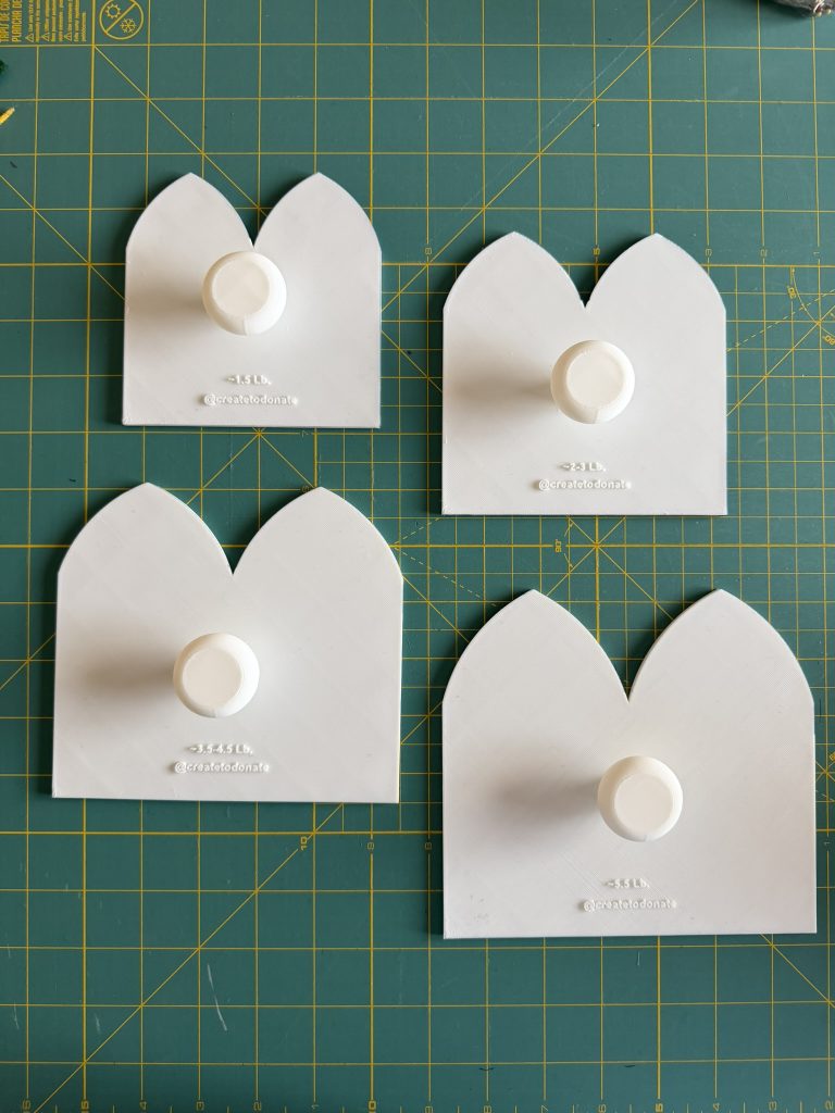 3D printed templates in white PLA used to make and donate preemies hat for premature babies in the NICU.