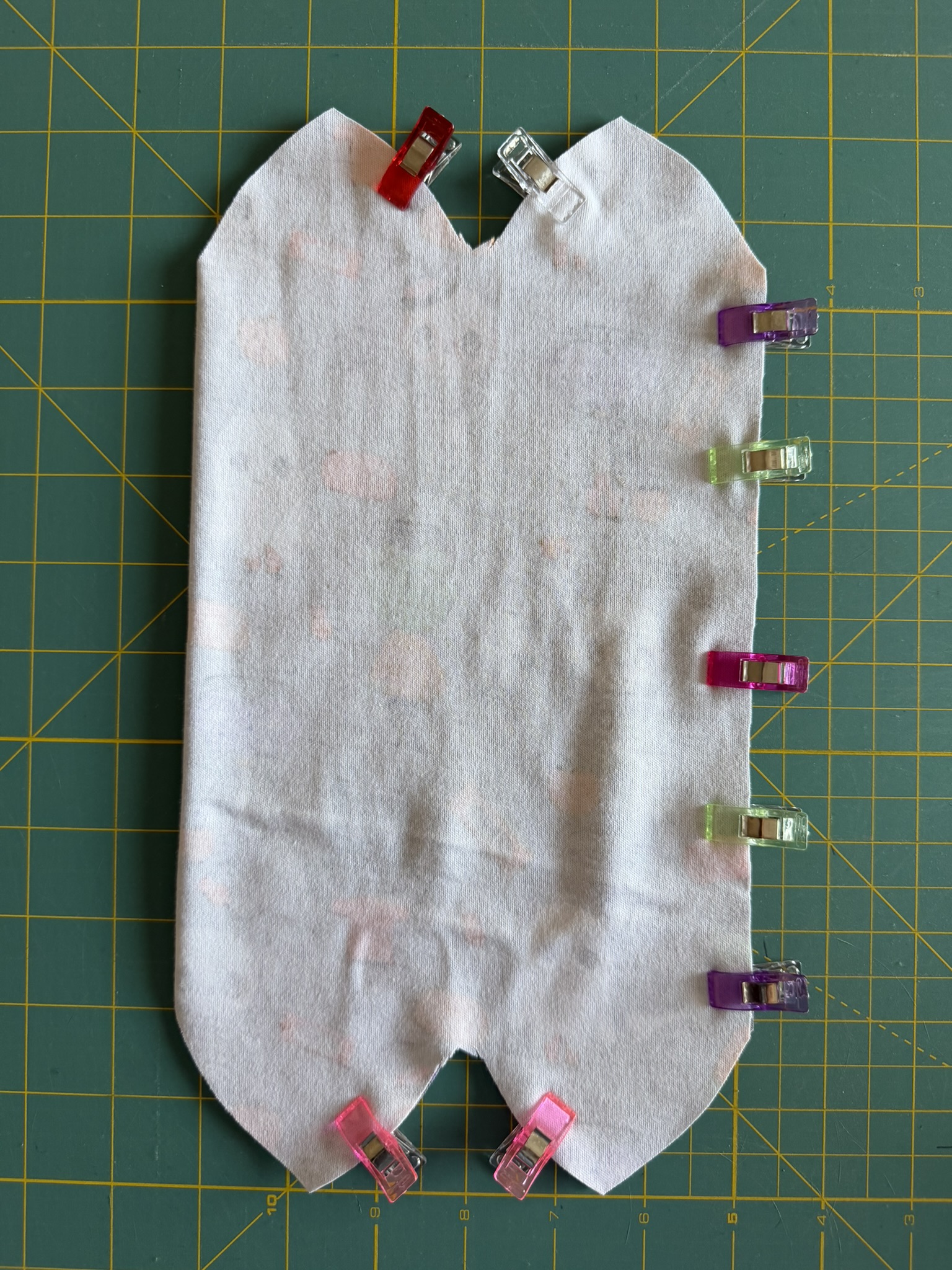 Clip the fabric right sides together to prepare for sewing.