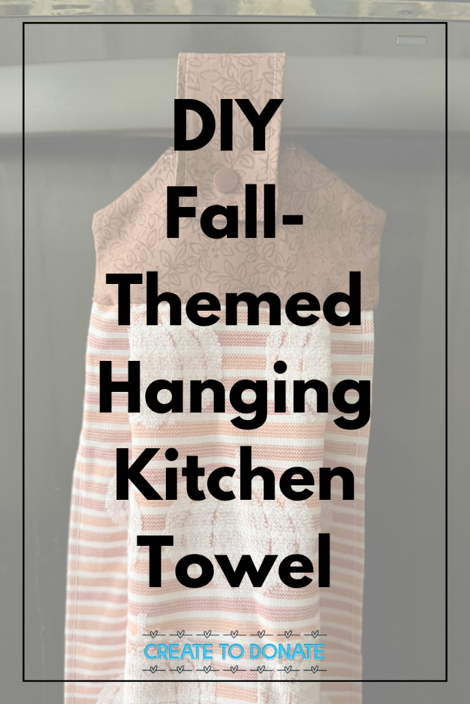 Pinterest image promoting a tutorial that teachers people how to make a DIY fall-themed hanging kitchen towel. The image features a towel with pumpkins hanging from a dishwasher handle.