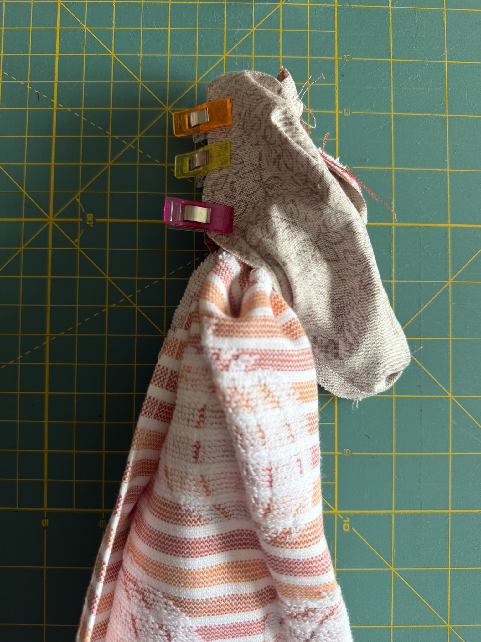 Towel with sewing clips on the fabric.